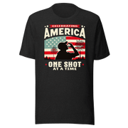 T-shirt with Celebrating America One Shot at a Time text, silhouette of a man drinking a shot, and distressed American flag background. Perfect for 4th of July.