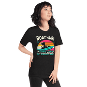 Tee with "Boar Hair Don't Care, But Where's My Drink?" and a woman on a jet ski against a retro sunset backdrop.