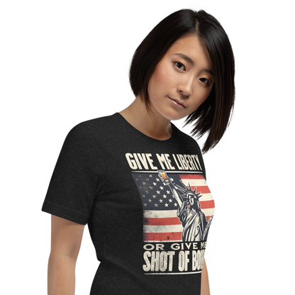 T-shirt with Give Me Liberty or Give Me a Shot of Bourbon text, Statue of Liberty holding a shot glass, and distressed American flag background. Perfect for 4th of July.