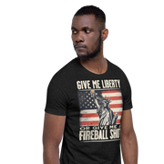 T-shirt with 'Give Me Liberty or Give Me a Fireball Shot' text, Statue of Liberty holding a shot glass, and distressed American flag background.