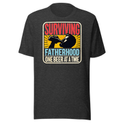 Celebrate fatherhood with our "Surviving Fatherhood One Beer at a Time" t-shirt. Perfect gift for dads who love a cold one. Ideal for Father's Day or birthdays.