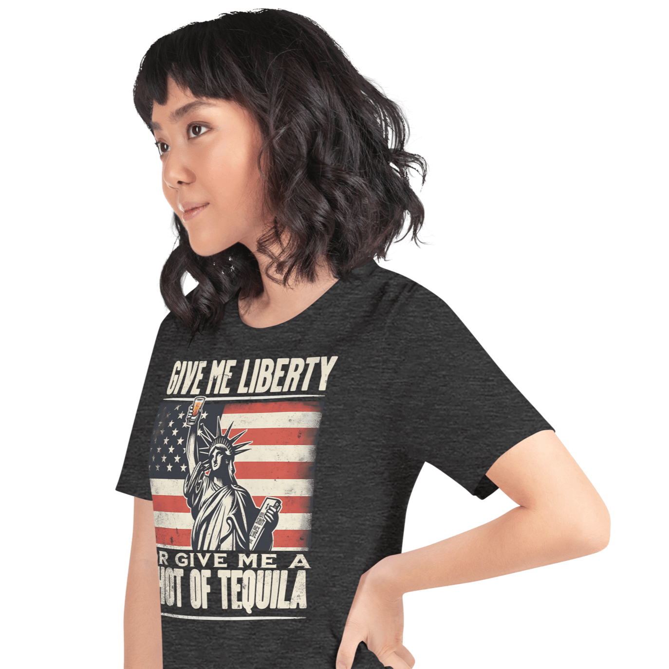 T-shirt with Give Me Liberty or Give Me a Shot of Tequila text, Statue of Liberty holding a shot glass, and distressed American flag background. Perfect for 4th of July.