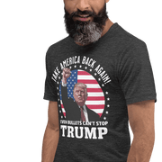 Man wearing "Even Bullets Can't Stop Trump" graphic tee with American flag background.