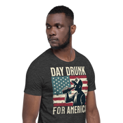 T-shirt with Day Drunk for America text, silhouette of a man drinking a bottle of beer, and distressed American flag background. Perfect for 4th of July.