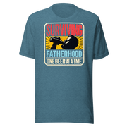 Celebrate fatherhood with our "Surviving Fatherhood One Beer at a Time" t-shirt. Perfect gift for dads who love a cold one. Ideal for Father's Day or birthdays.