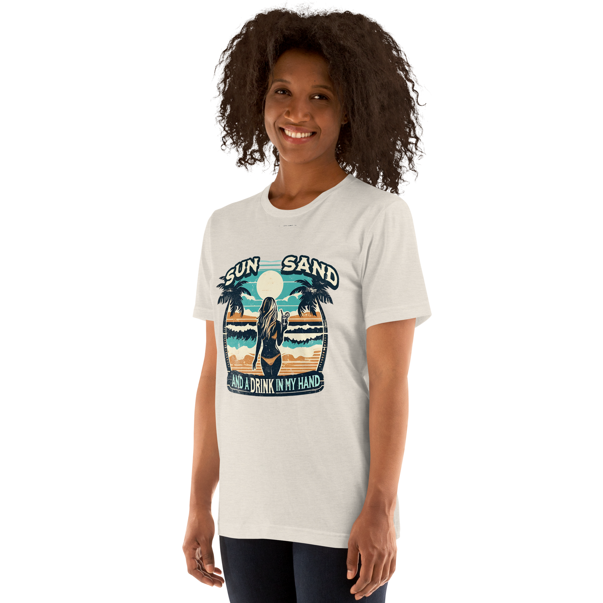 Woman with cocktail on beach on 'Sun, Sand, and a Drink in My Hand' tee, showcasing ocean and sun background