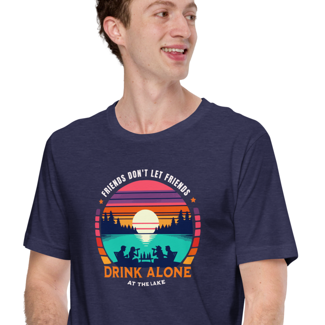 Tee showcasing "Friends Don't Let Friends Drink Alone at the Lake" with a retro sunset and lake scene.