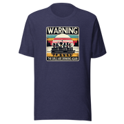 Tee showing "Warning: The Girls Are Drinking Again" with an image of girls on a pontoon boat enjoying drinks at sunset.