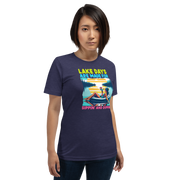 Tee with "Lake Days Are Made for Sipping and Dipping," featuring a woman on a tube float with a cocktail, lake and sunset backdrop.