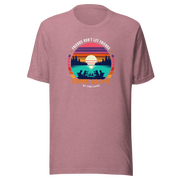 Tee showcasing "Friends Don't Let Friends Drink Alone at the Lake" with a retro sunset and lake scene.