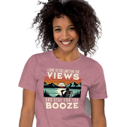 Tee showing "I Come to the Lake for the Views and Stay for the Booze," with a man in a beach chair, lake, and retro sunset.