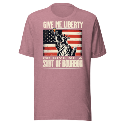 T-shirt with Give Me Liberty or Give Me a Shot of Bourbon text, Statue of Liberty holding a shot glass, and distressed American flag background. Perfect for 4th of July.