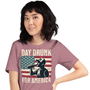 T-shirt with Day Drunk for America text, silhouette of a man drinking a bottle of beer, and distressed American flag background. Perfect for 4th of July.