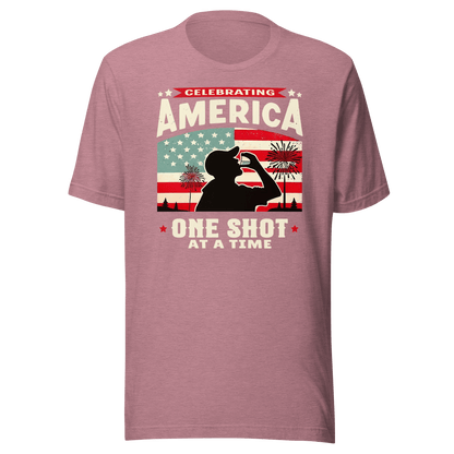 T-shirt with Celebrating America One Shot at a Time text, silhouette of a man drinking a shot, and distressed American flag background. Perfect for 4th of July.