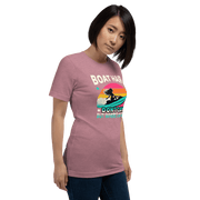 Tee with "Boar Hair Don't Care, But Where's My Drink?" and a woman on a jet ski against a retro sunset backdrop.