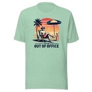 Man lounging in a beach chair with a cocktail, wearing our 'Sorry, Out of Office' vintage tee against a retro sunset backdrop.