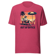 Man lounging in a beach chair with a cocktail, wearing our 'Sorry, Out of Office' vintage tee against a retro sunset backdrop.