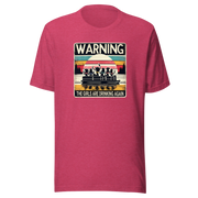 Tee showing "Warning: The Girls Are Drinking Again" with an image of girls on a pontoon boat enjoying drinks at sunset.