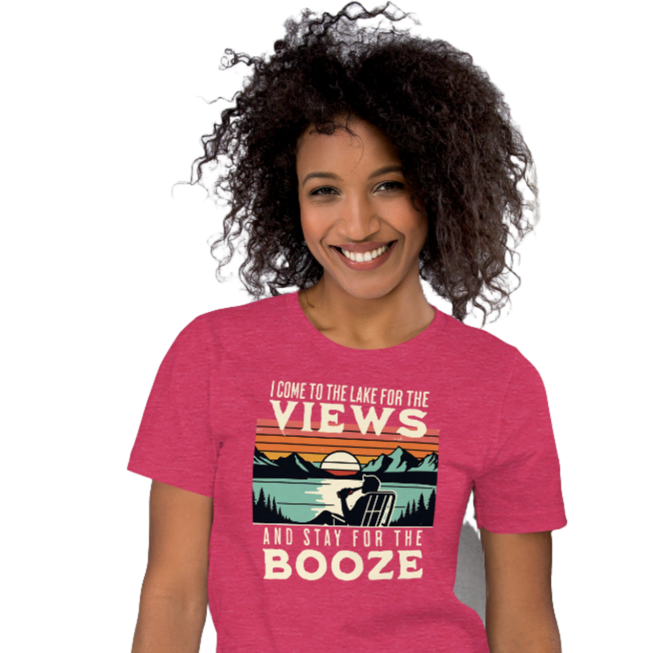 Tee showing "I Come to the Lake for the Views and Stay for the Booze," with a man in a beach chair, lake, and retro sunset.