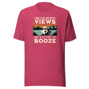 Tee showing "I Come to the Lake for the Views and Stay for the Booze," with a man in a beach chair, lake, and retro sunset.