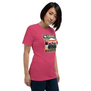 Tee showing "Warning: The Girls Are Drinking Again" with an image of girls on a pontoon boat enjoying drinks at sunset.