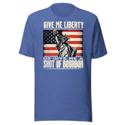 T-shirt with Give Me Liberty or Give Me a Shot of Bourbon text, Statue of Liberty holding a shot glass, and distressed American flag background. Perfect for 4th of July.