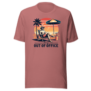 Man lounging in a beach chair with a cocktail, wearing our 'Sorry, Out of Office' vintage tee against a retro sunset backdrop.