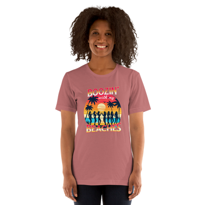 Silhouettes of women drinking cocktails on the beach at sunset in 'Boozin' with My Beaches' tee.