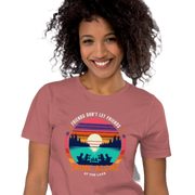 Tee showcasing "Friends Don't Let Friends Drink Alone at the Lake" with a retro sunset and lake scene.