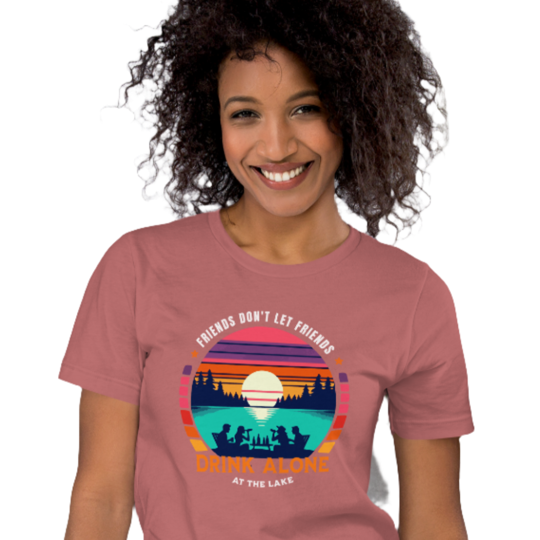 Tee showcasing "Friends Don't Let Friends Drink Alone at the Lake" with a retro sunset and lake scene.