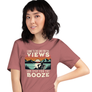 Tee showing "I Come to the Lake for the Views and Stay for the Booze," with a man in a beach chair, lake, and retro sunset.