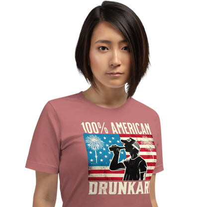 4th of July T-shirt with '100% American Drunkard' text, man drinking a bottle of beer wearing a trucker hat, and distressed American flag background