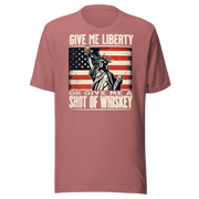 'Give Me Liberty or Give Me Whiskey' text, Statue of Liberty holding a shot glass, and distressed American flag background