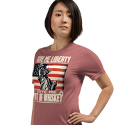 'Give Me Liberty or Give Me Whiskey' text, Statue of Liberty holding a shot glass, and distressed American flag background