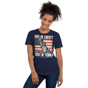 T-shirt with Give Me Liberty or Give Me a Shot of Tequila text, Statue of Liberty holding a shot glass, and distressed American flag background. Perfect for 4th of July.