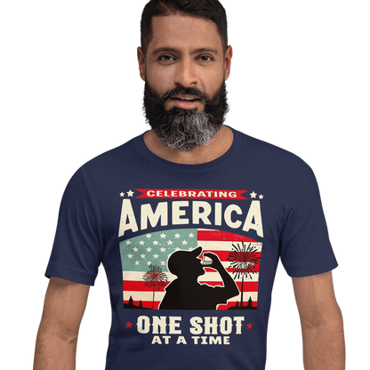 T-shirt with Celebrating America One Shot at a Time text, silhouette of a man drinking a shot, and distressed American flag background. Perfect for 4th of July.