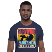 Celebrate fatherhood with our "Surviving Fatherhood One Beer at a Time" t-shirt. Perfect gift for dads who love a cold one. Ideal for Father's Day or birthdays.