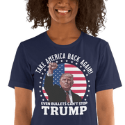 Woman wearing "Even Bullets Can't Stop Trump" cotton t-shirt with American flag background, promoting patriotic message.