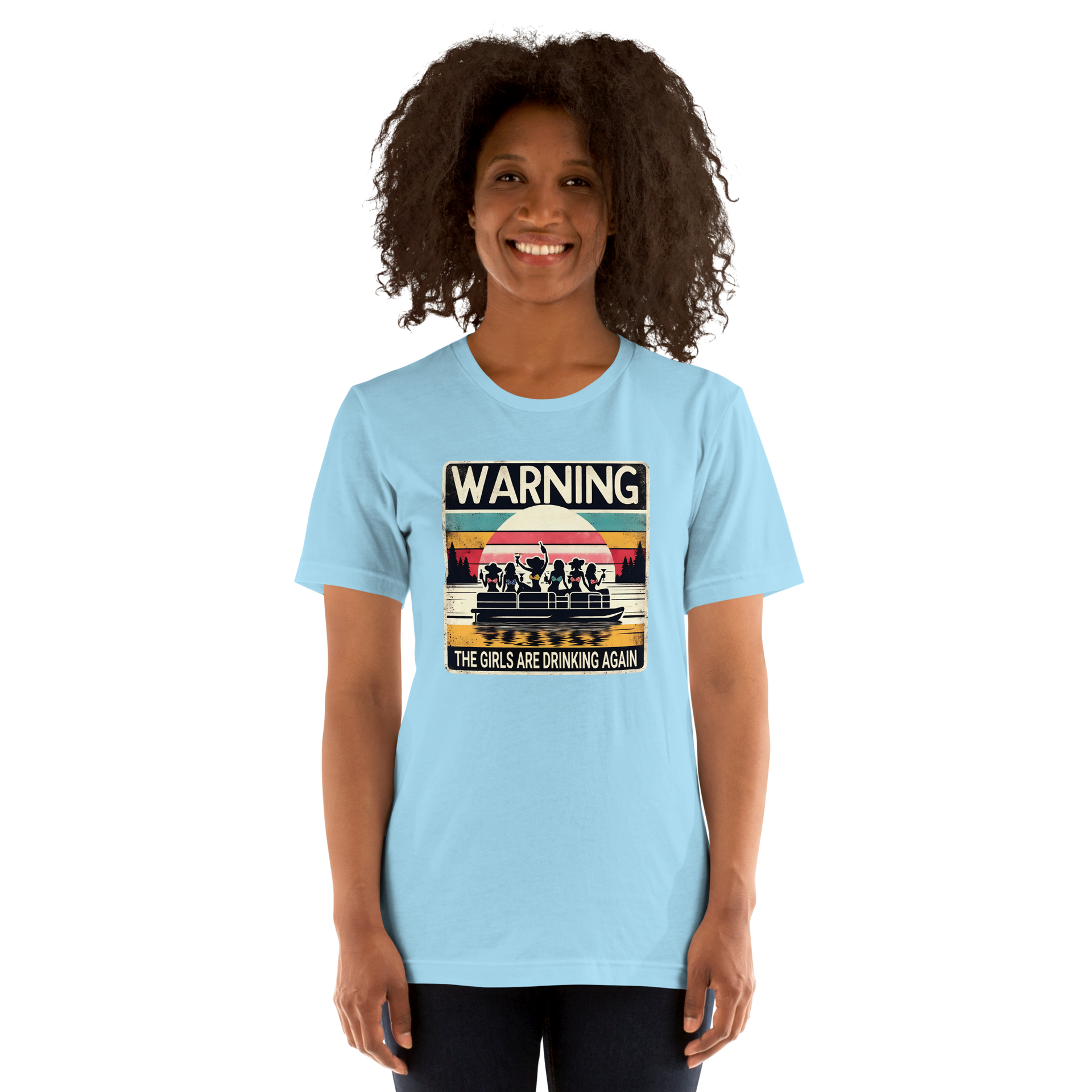 Tee showing "Warning: The Girls Are Drinking Again" with an image of girls on a pontoon boat enjoying drinks at sunset.