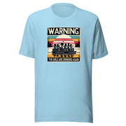 Tee showing "Warning: The Girls Are Drinking Again" with an image of girls on a pontoon boat enjoying drinks at sunset.