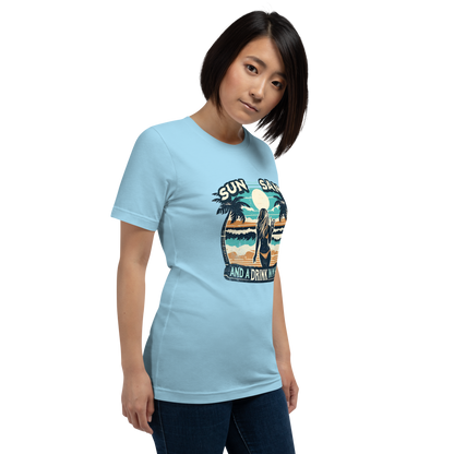 Woman with cocktail on beach on 'Sun, Sand, and a Drink in My Hand' tee, showcasing ocean and sun background