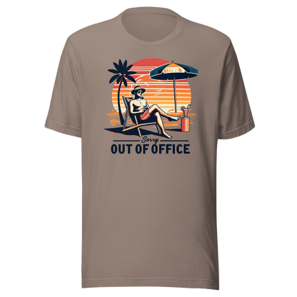 Man lounging in a beach chair with a cocktail, wearing our 'Sorry, Out of Office' vintage tee against a retro sunset backdrop.