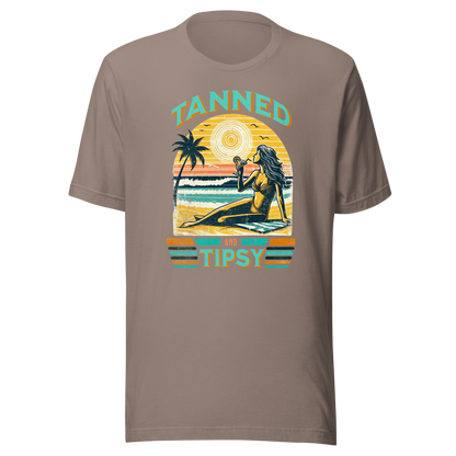 Vintage-inspired 'Tanned and Tipsy' tee with a woman sipping a cocktail on a beach at sunset, perfect for beach drinking and summer parties.