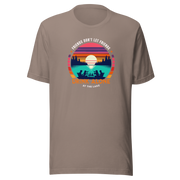 Tee showcasing "Friends Don't Let Friends Drink Alone at the Lake" with a retro sunset and lake scene.