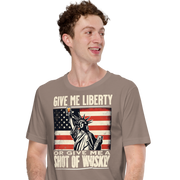 'Give Me Liberty or Give Me Whiskey' text, Statue of Liberty holding a shot glass, and distressed American flag background