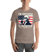 T-shirt with In George Sloshington We Trust text, image of George Washington drinking a beer, and distressed American flag background. Perfect for 4th of July.