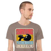 Celebrate fatherhood with our "Surviving Fatherhood One Beer at a Time" t-shirt. Perfect gift for dads who love a cold one. Ideal for Father's Day or birthdays.