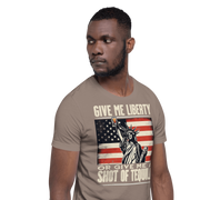 T-shirt with Give Me Liberty or Give Me a Shot of Tequila text, Statue of Liberty holding a shot glass, and distressed American flag background. Perfect for 4th of July.