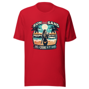 Woman with cocktail on beach on 'Sun, Sand, and a Drink in My Hand' tee, showcasing ocean and sun background