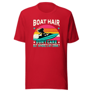 Tee with "Boar Hair Don't Care, But Where's My Drink?" and a woman on a jet ski against a retro sunset backdrop.